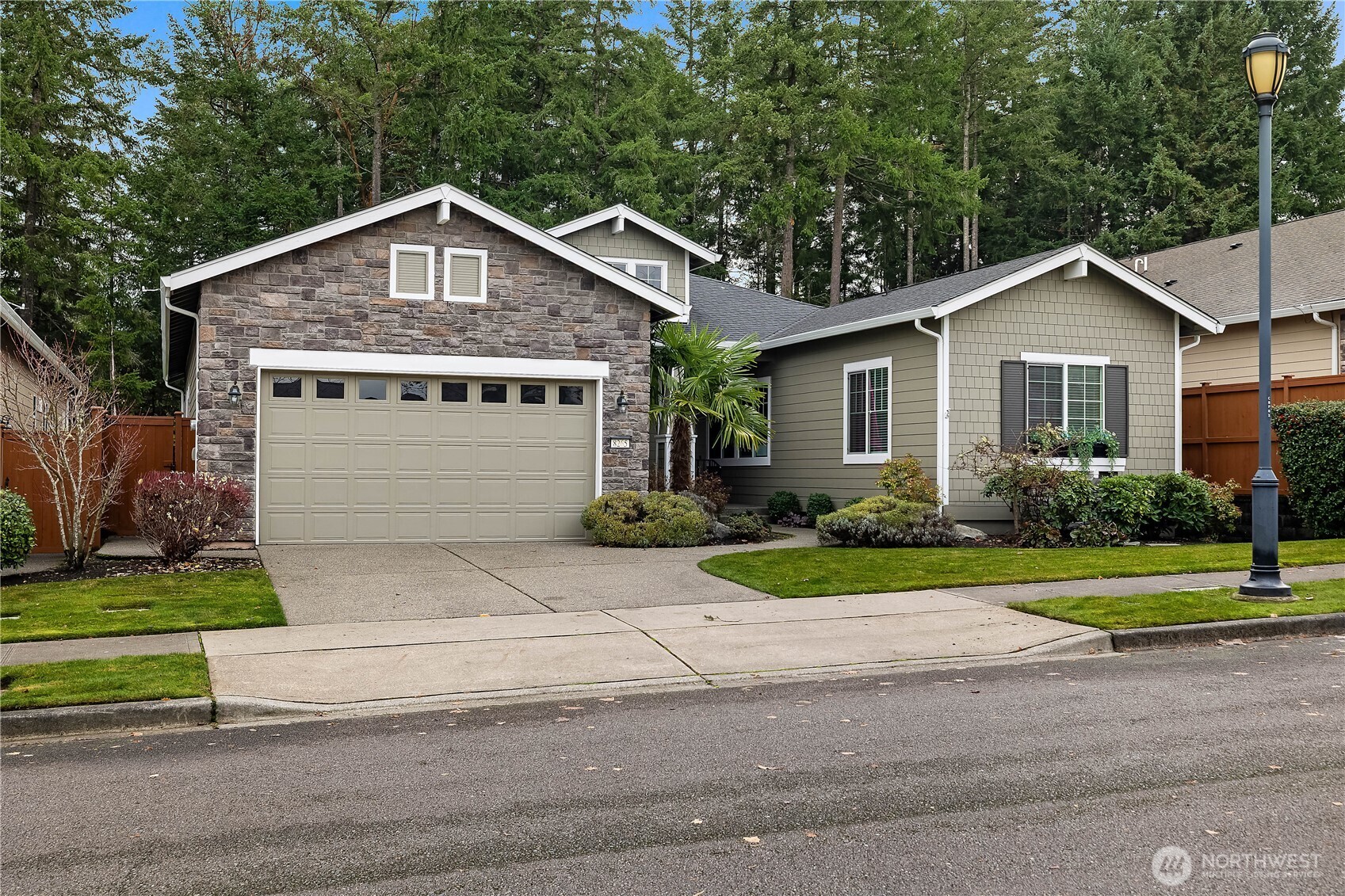 8265 Orcas Loop Northeast Lacey, WA 98516 - Photo 22 of 39 a front view of a house with a yard