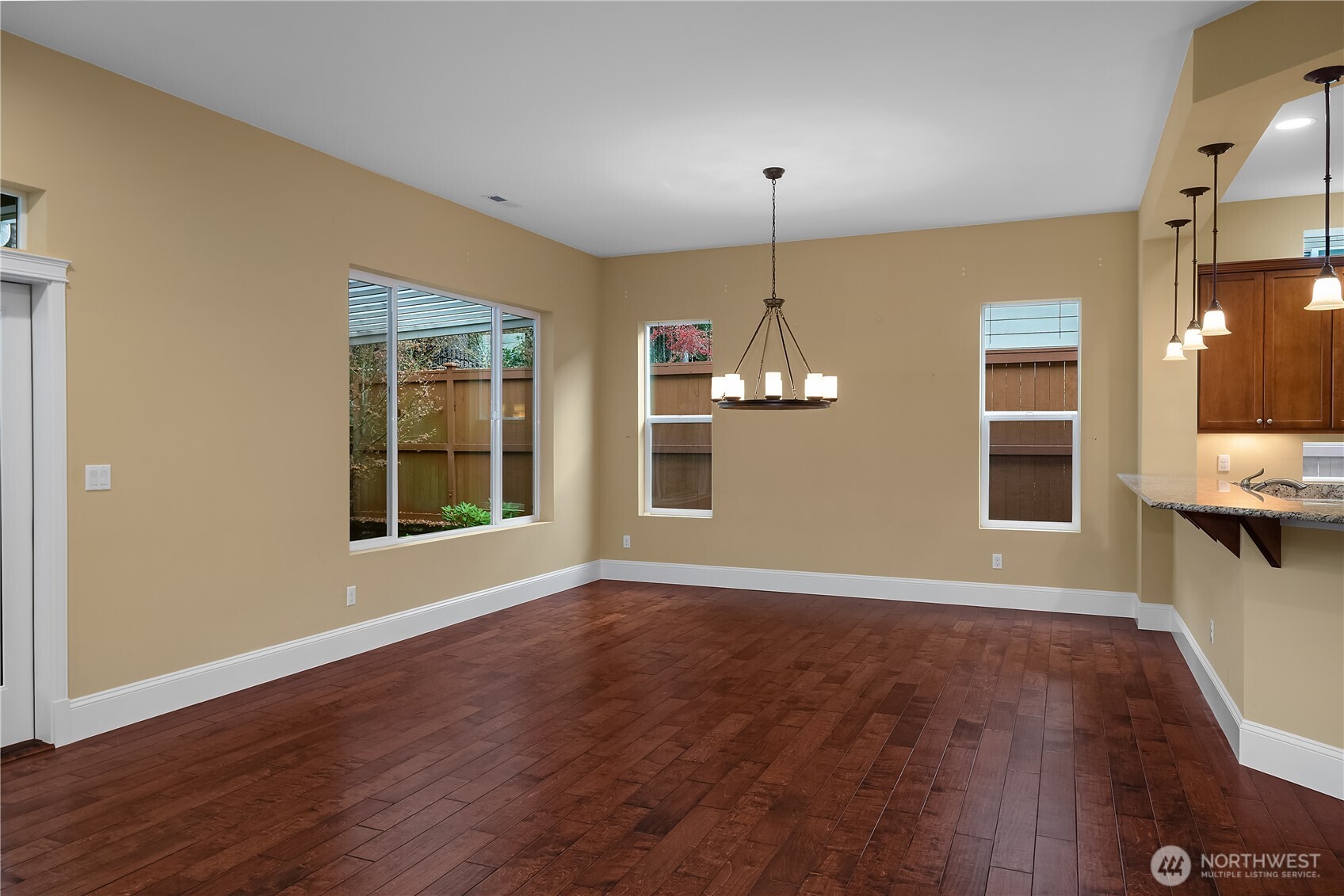 8265 Orcas Loop Northeast Lacey, WA 98516 - Photo 27 of 39 wooden floor in an empty room with a window