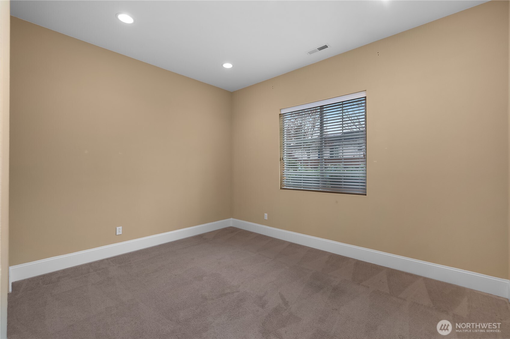 8265 Orcas Loop Northeast Lacey, WA 98516 - Photo 30 of 39 a view of an empty room with a window