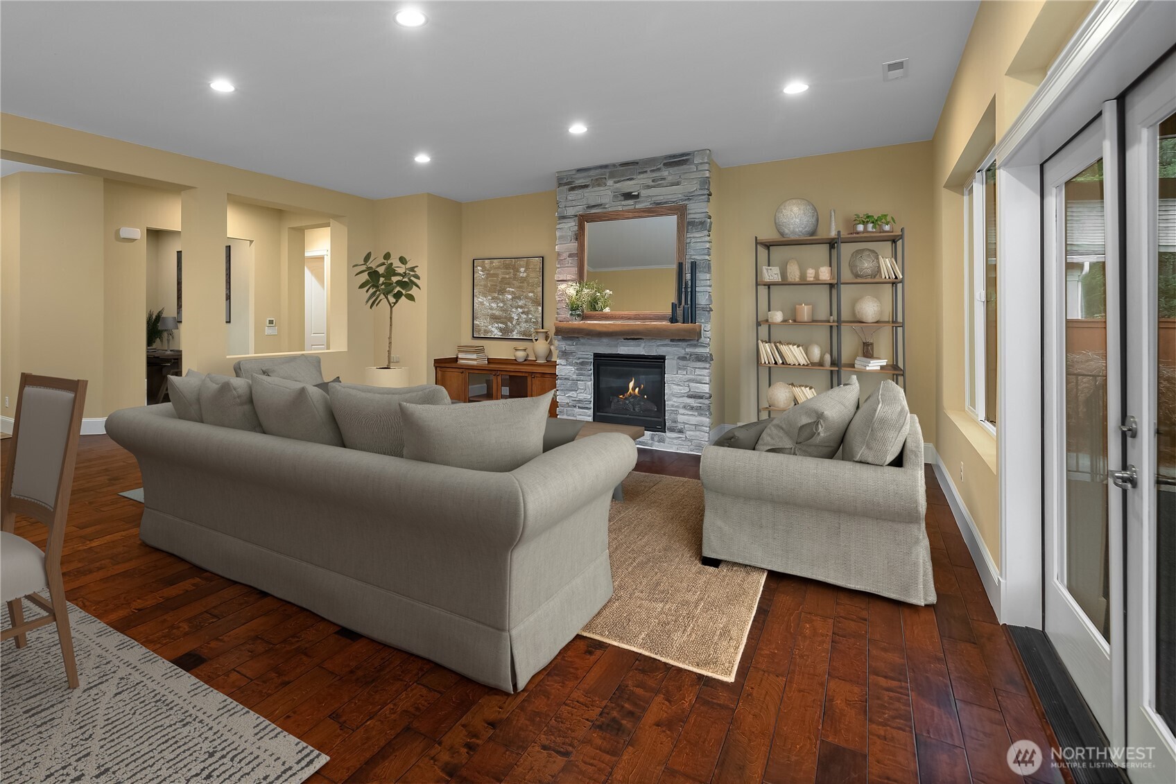 8265 Orcas Loop Northeast Lacey, WA 98516 - Photo 4 of 39 a living room with furniture fireplace and a flat screen tv