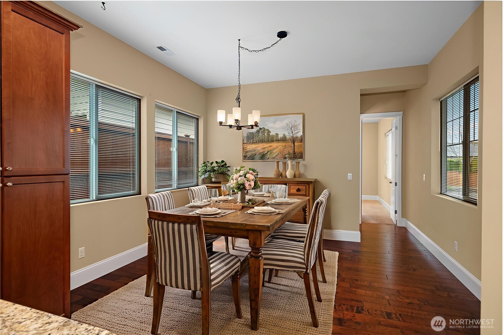 8265 Orcas Loop Northeast Lacey, WA 98516 - Photo 8 of 39 a view of a dining room with furniture window and wooden floor