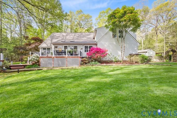 a view of a house with a yard and garage