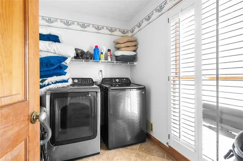 a kitchen with a refrigerator and a stove