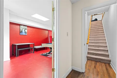 a view of a livingroom with furniture and staircase