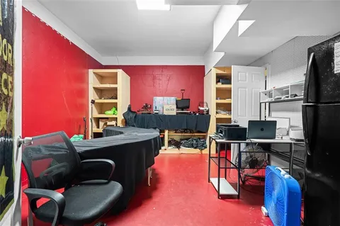 a room with furniture and a flat screen tv