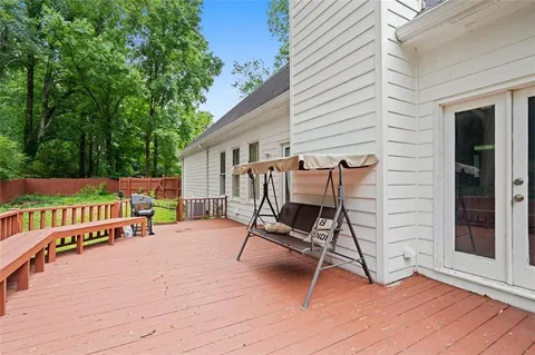 a deck with a table and chairs