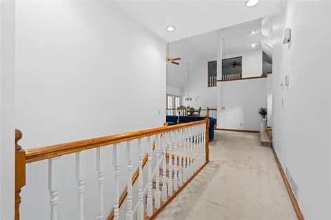 a view of a hallway with stairs