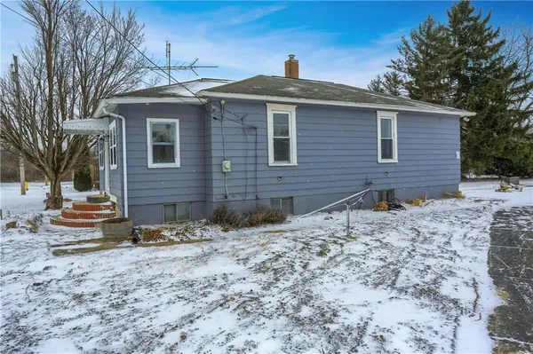 a front view of house with yard and seating space