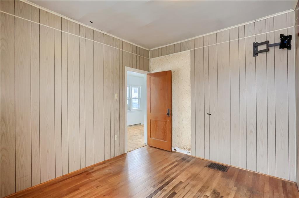 314 13th Street Bessemer, PA 16112 - Photo 11 of 26 a view of a room with wooden floor and windows