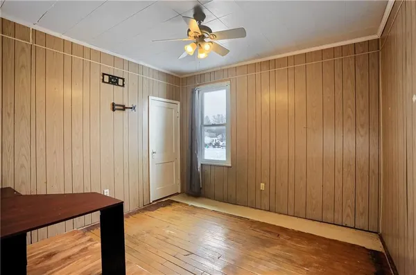 a view of a bedroom with a wooden door