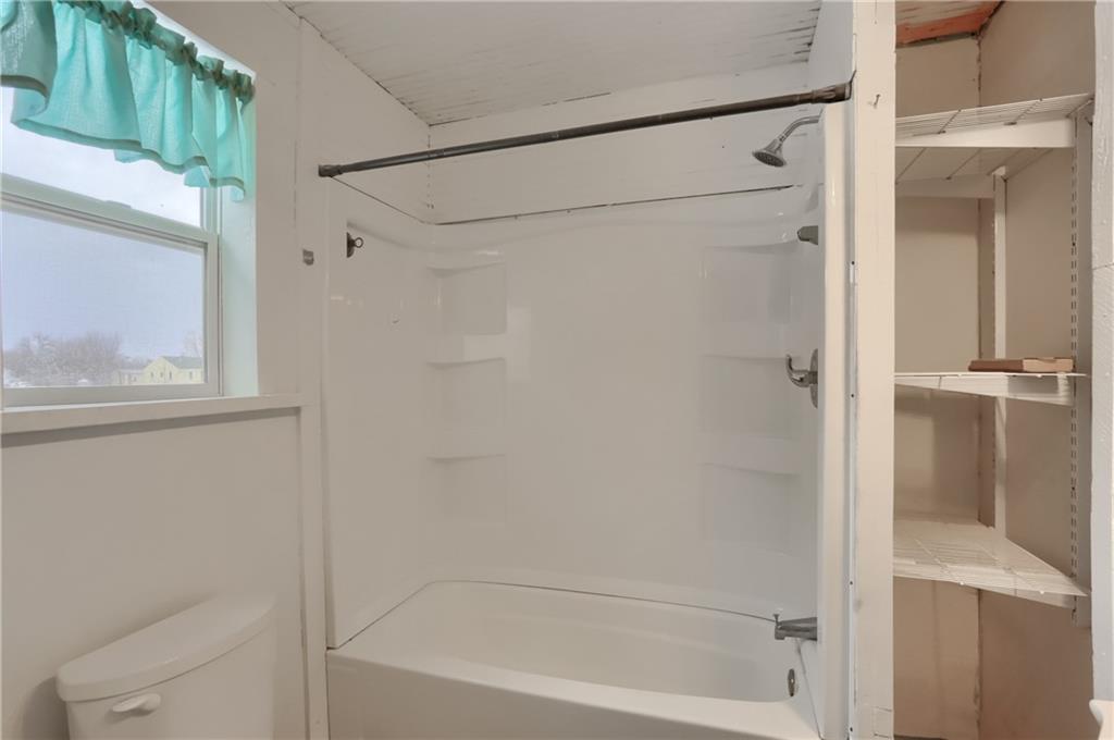 314 13th Street Bessemer, PA 16112 - Photo 23 of 26 a bathroom with a bathtub