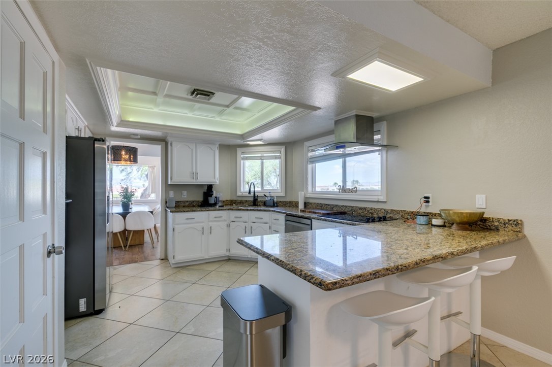 892 North Hollywood Boulevard Las Vegas, NV 89110 - Photo 14 of 81 This spacious kitchen offers ample counter space and an open flow, perfect for entertaining.