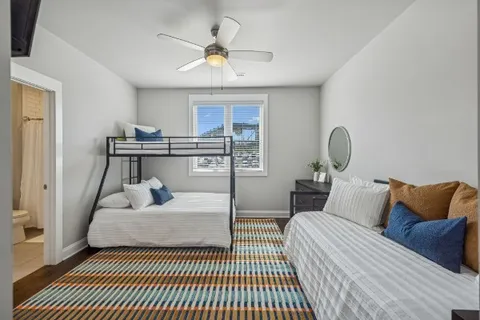 a bedroom with a bed and a table