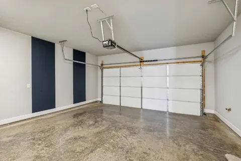 a front view of a building with a garden