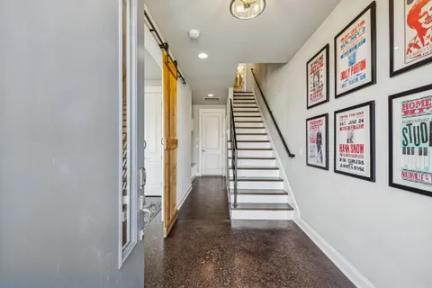 a view of an entryway with wooden floor
