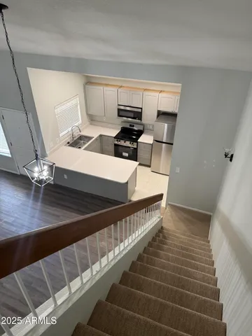 a view of kitchen and wooden floor