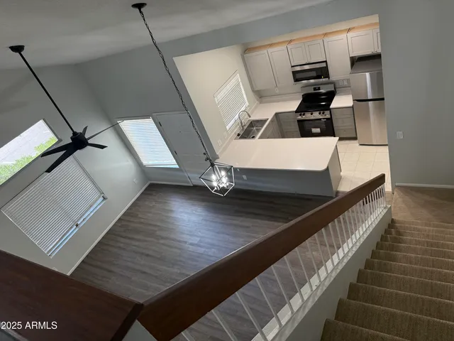 a view of kitchen with wooden floor