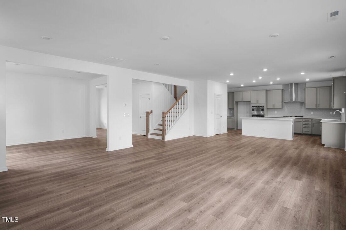 925 Kinglet House Road Knightdale, NC 27545 - Photo 5 of 36 silverstone-bedford-tv-lounge-to-kitchen