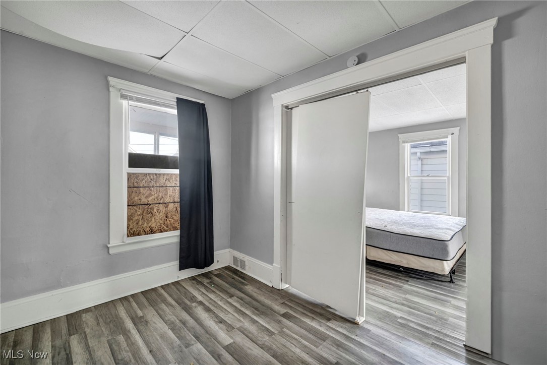 3405 Roehl Avenue Cleveland, OH 44109 - Photo 30 of 50 Empty room featuring wood finished floors and a drop ceiling