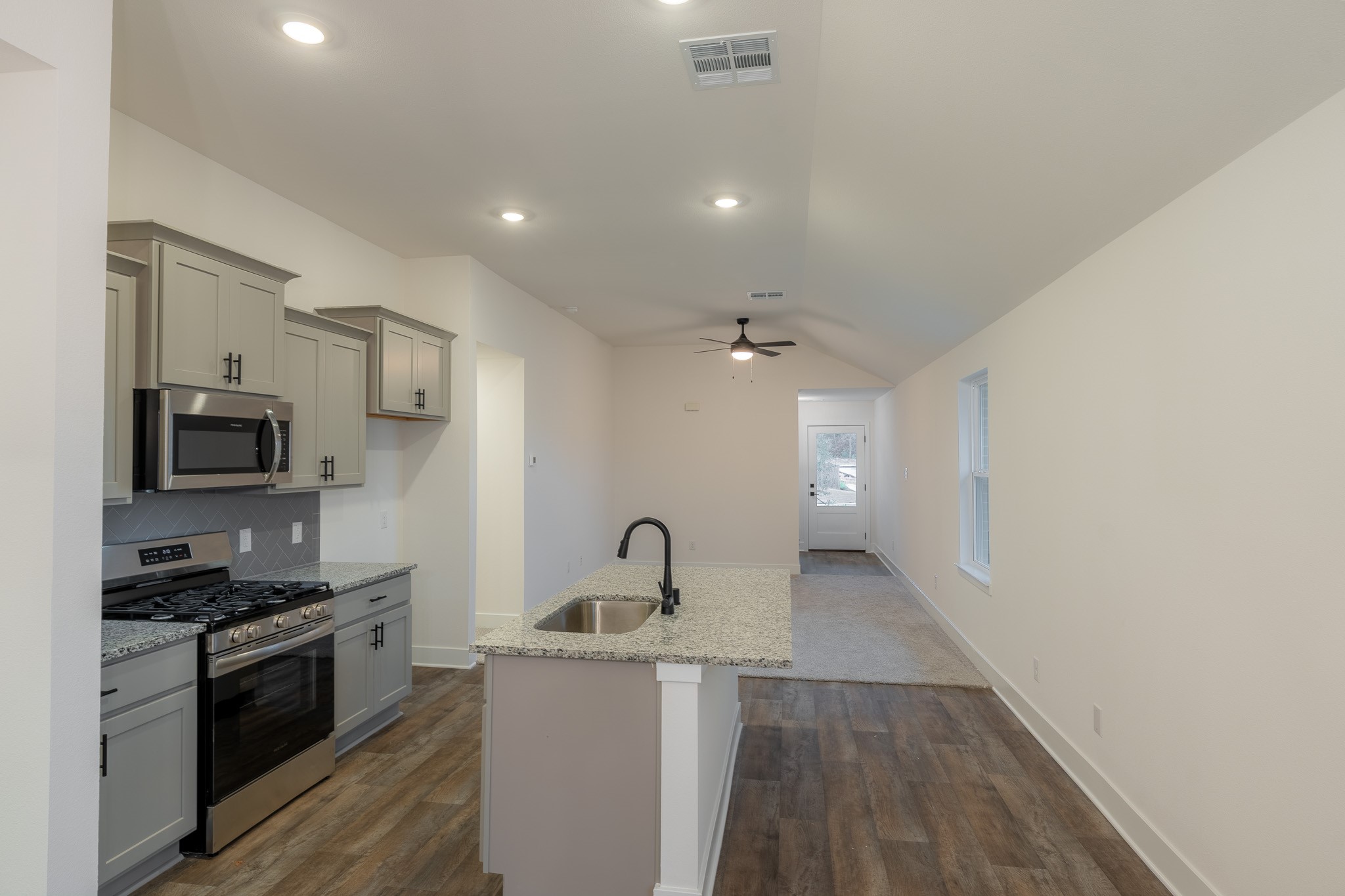 9456 Hard Rock Road Conroe, TX 77303 - Photo 8 of 19 View of Kitchen & Living from Dining Area