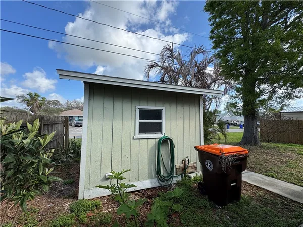 a view of a small house with a sink and garden
