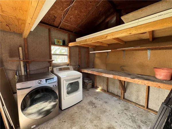 a utility room with dryer and washer