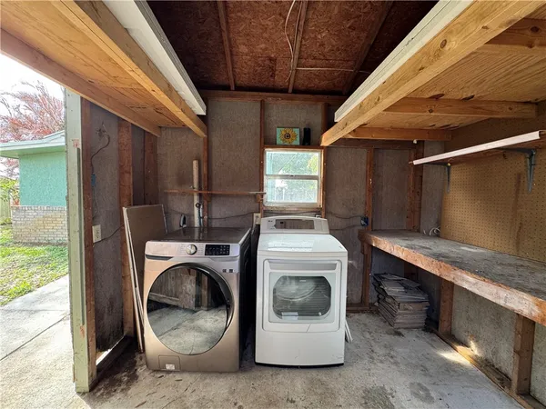 a utility room with dryer and washer