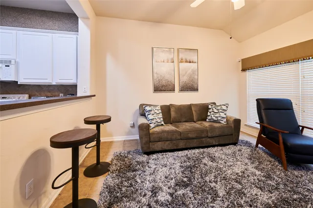 a living room with furniture and a couch