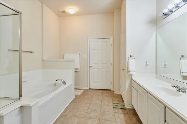 a bathroom with a bathtub and a sink