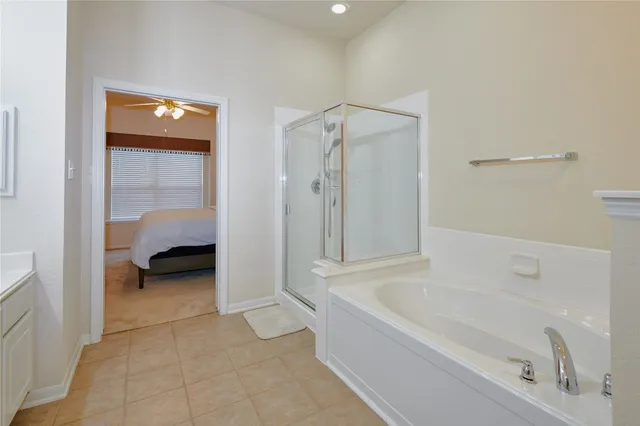a bathroom with a tub and a shower