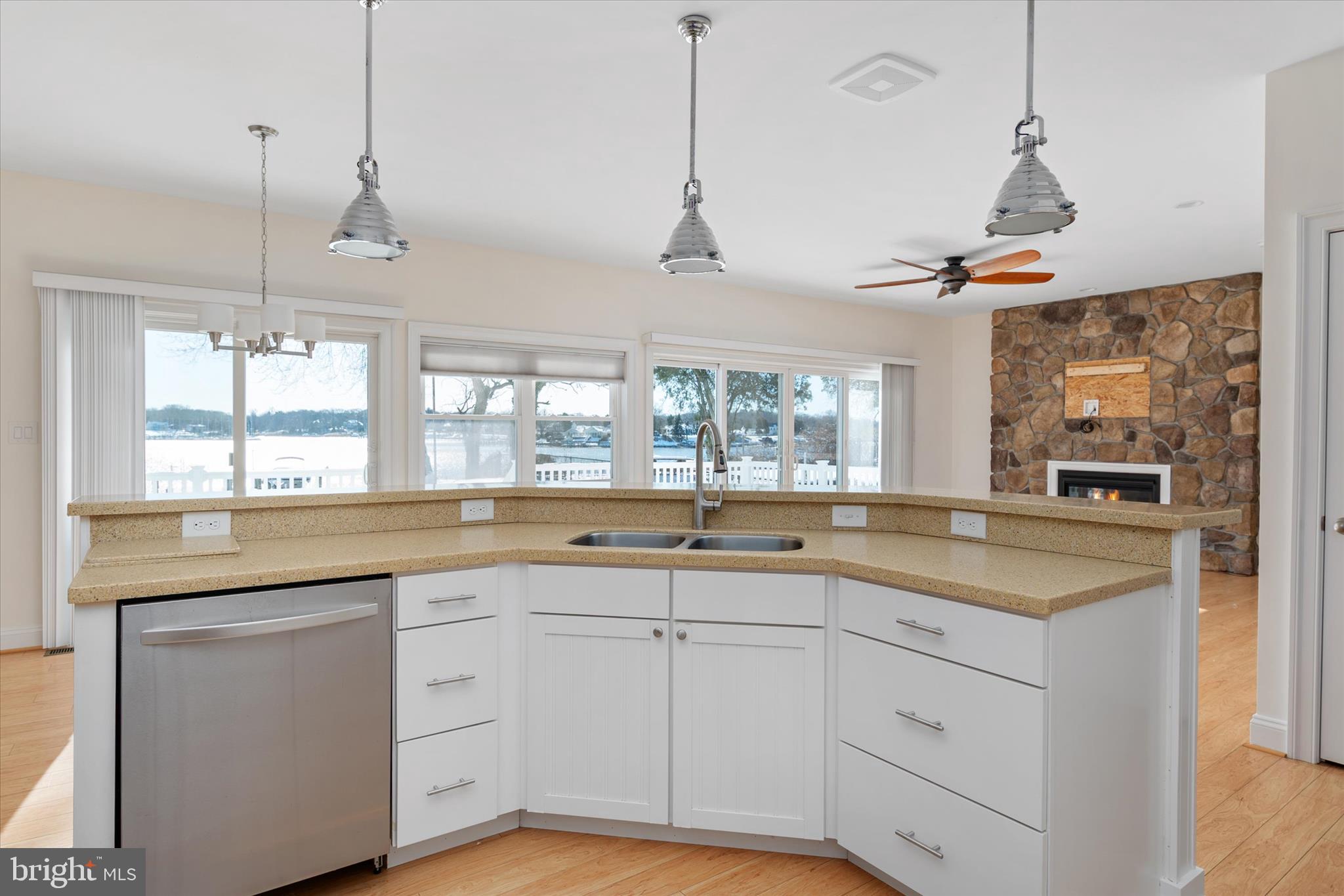 204 Bar Harbor Road Pasadena, MD 21122 - Photo 12 of 43 a kitchen with white cabinets and white appliances