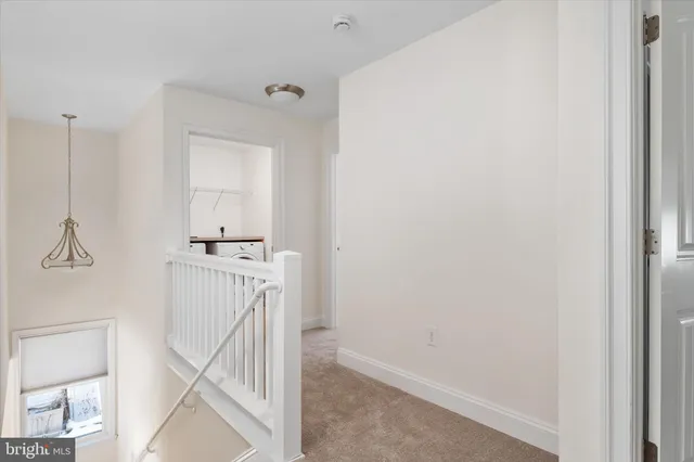 a utility room with cabinets washer and dryer