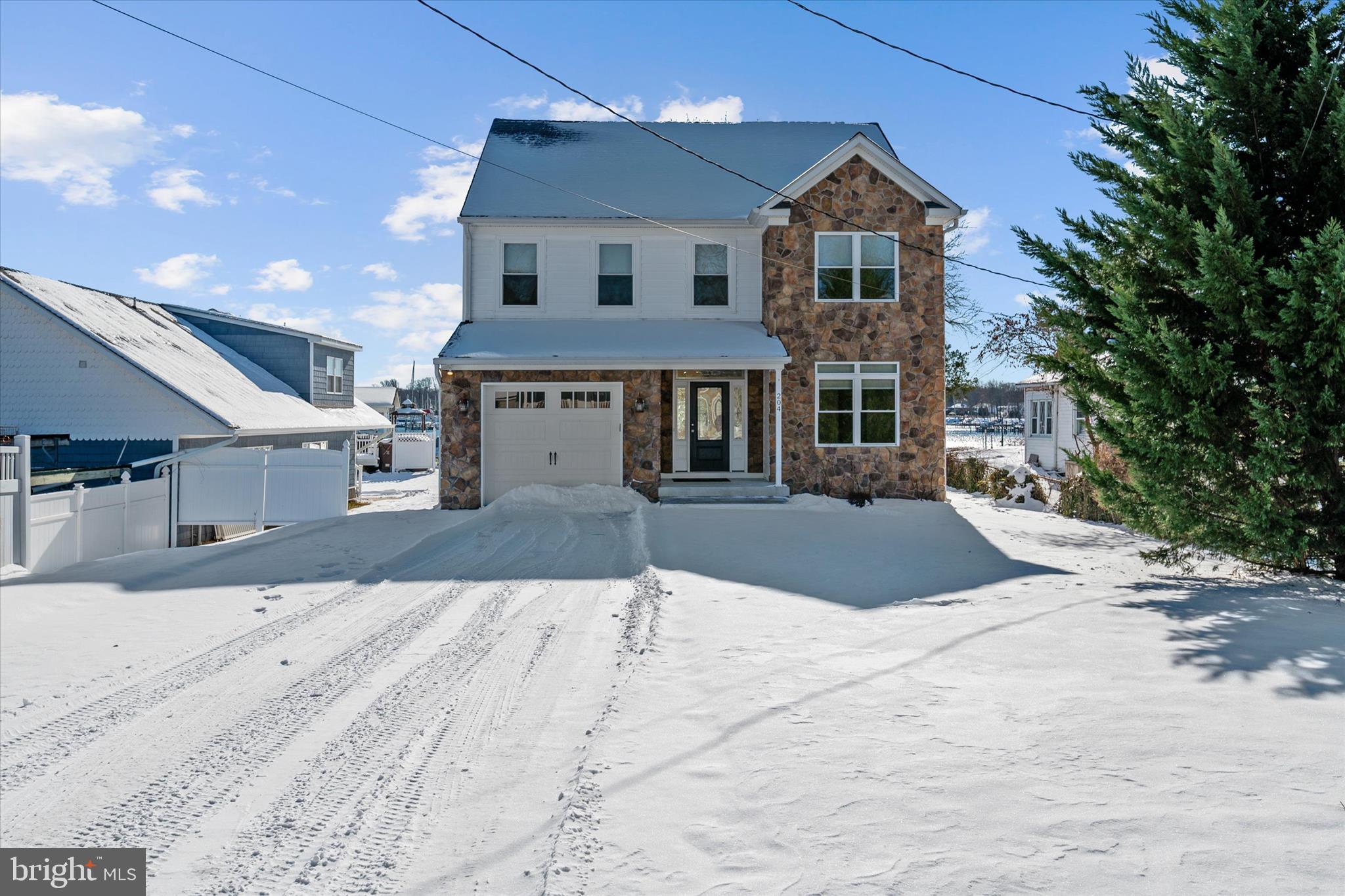 204 Bar Harbor Road Pasadena, MD 21122 - Photo 2 of 43 a front view of a house with a yard
