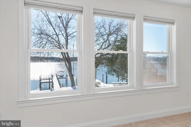 a view of a wooden door and a wooden deck