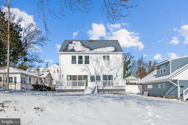 a front view of a building with a yard