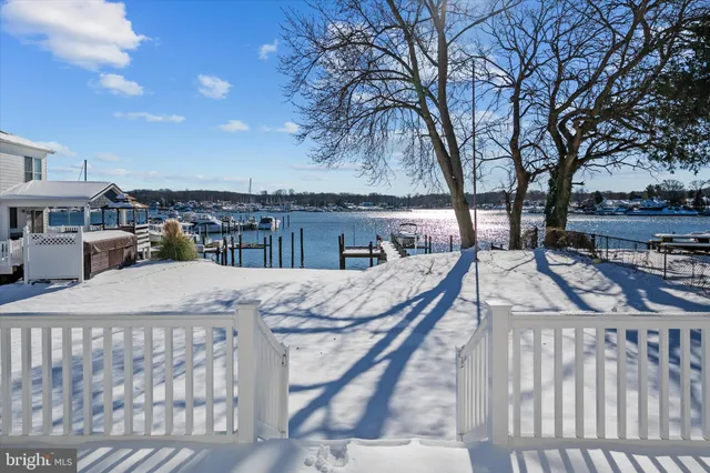 a view of a balcony with two chairs