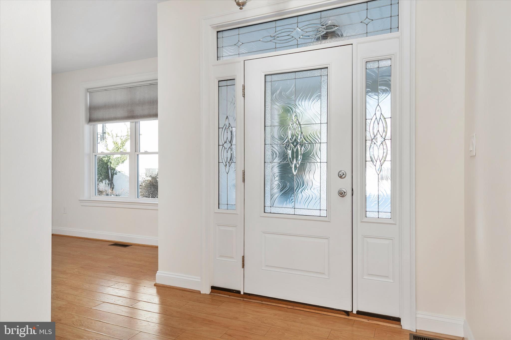 204 Bar Harbor Road Pasadena, MD 21122 - Photo 5 of 43 a view of an empty room with wooden floor and a window