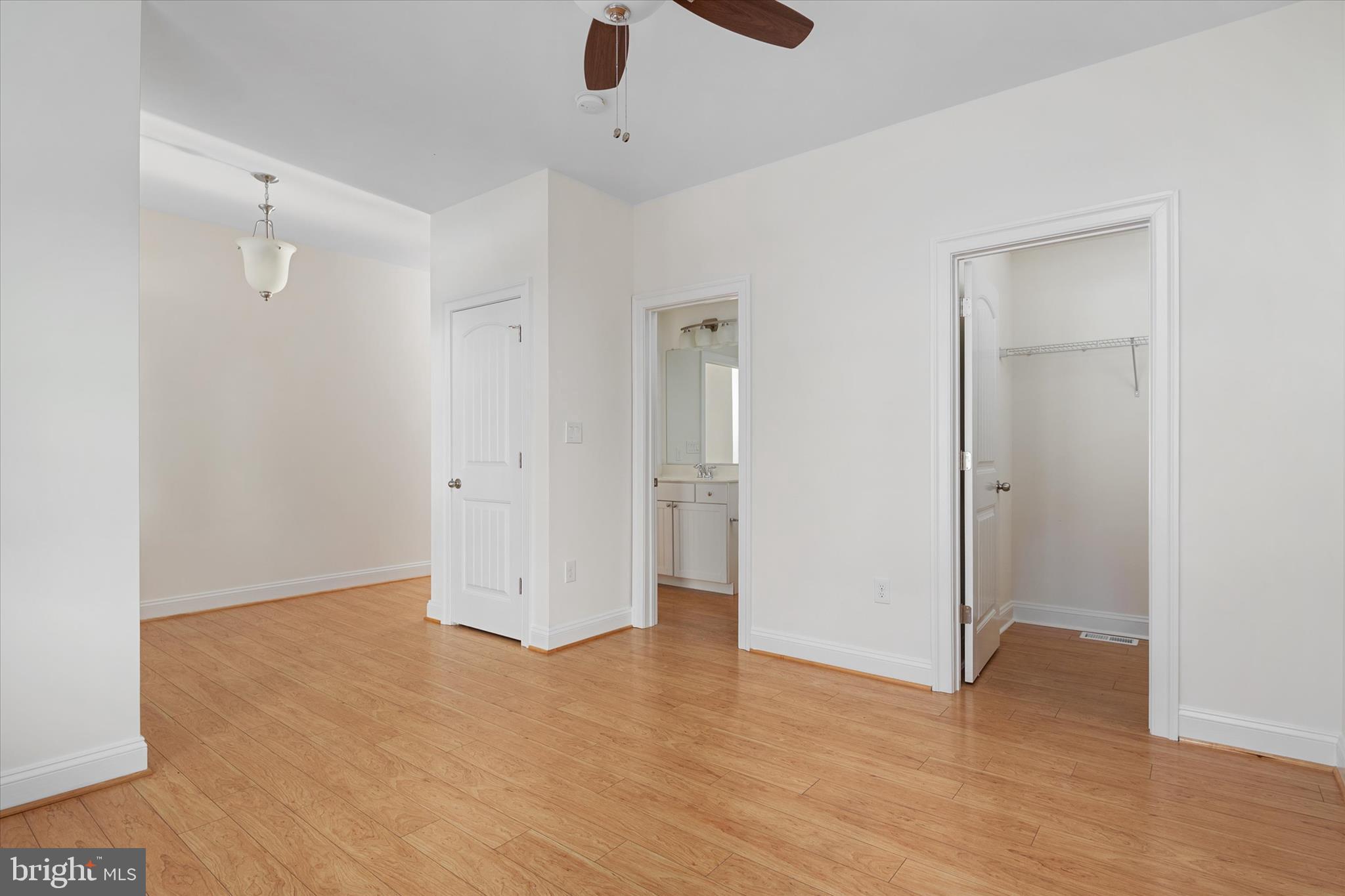 204 Bar Harbor Road Pasadena, MD 21122 - Photo 7 of 43 an empty room with wooden floor and windows