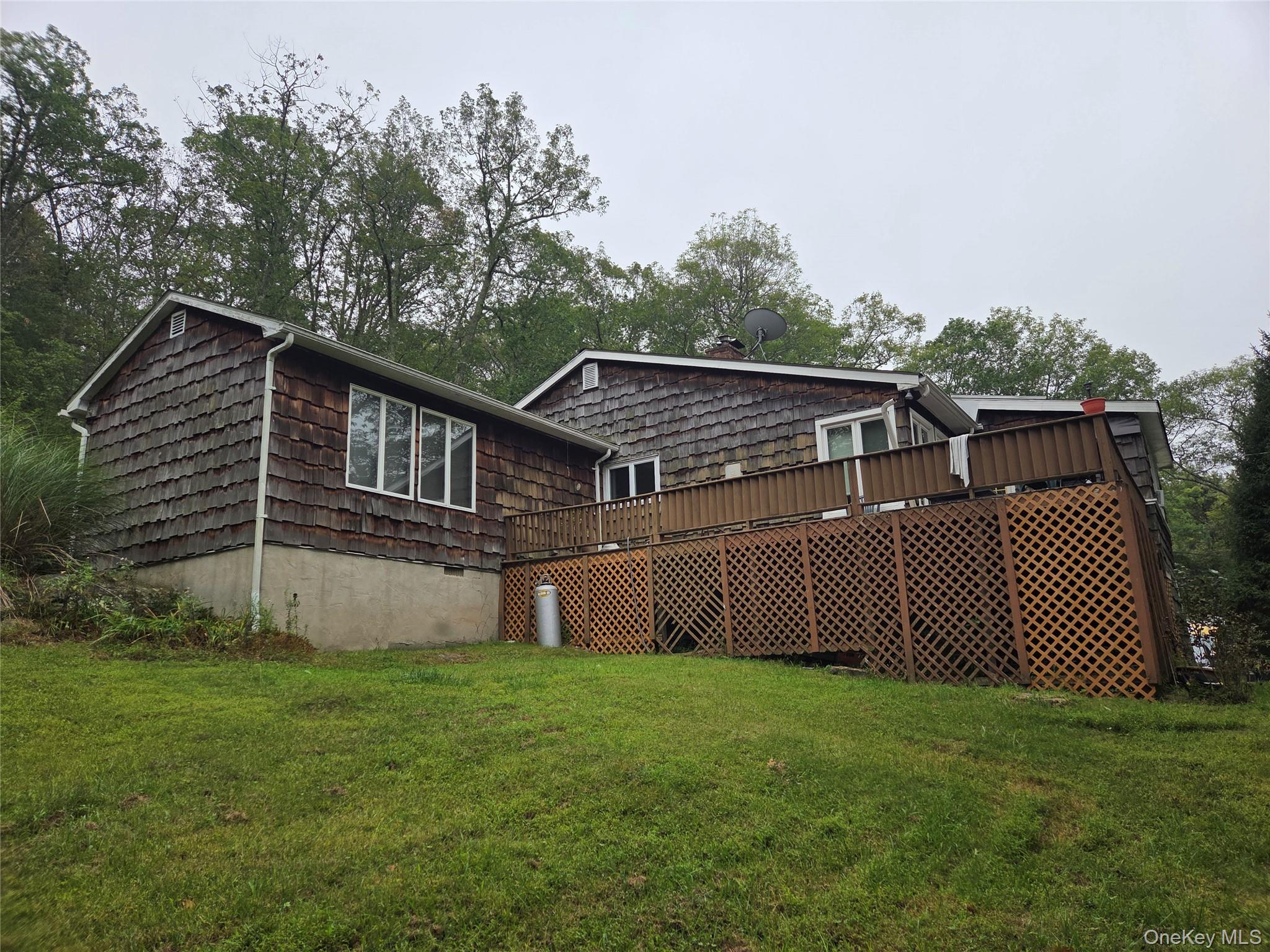 63 Otens Road Ellenville, NY 12428 - Photo 2 of 32 a front view of a house with garden