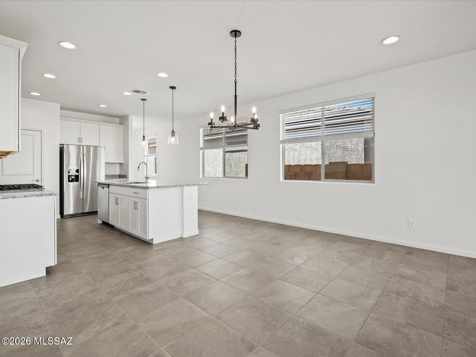 5180 West Bowen House Road Tucson, AZ 85757 - Photo 4 of 13 Photo is not of the actual home, but is an inspirational photo of builder’s model home and may depict options, furnishings, and/or decorator features that are not included