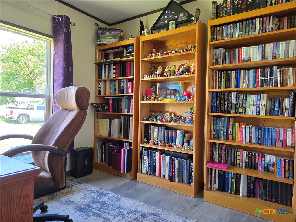 412 Coryell City Road Gatesville, TX 76528 - Photo 17 of 34 a view of room with furniture and large book shelf