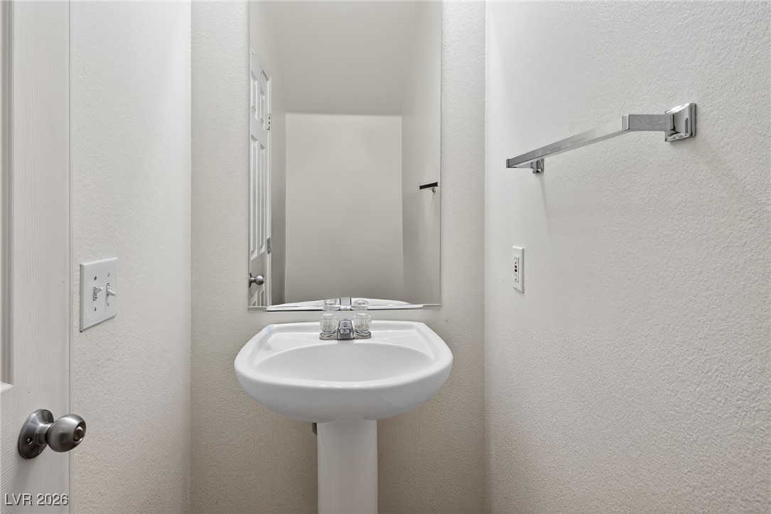 8038 Kings Ransom Street Las Vegas, NV 89139 - Photo 12 of 38 Bathroom featuring a textured wall