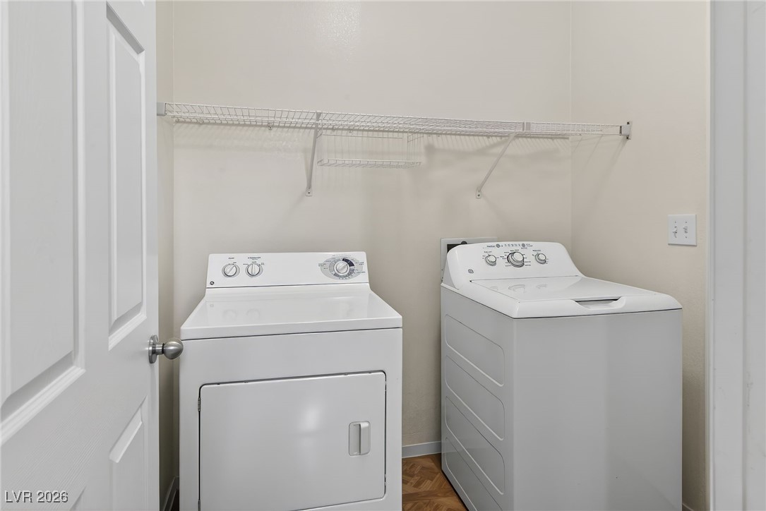 8038 Kings Ransom Street Las Vegas, NV 89139 - Photo 13 of 38 Laundry room featuring parquet floors and separate washer and dryer