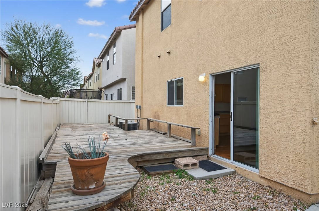8038 Kings Ransom Street Las Vegas, NV 89139 - Photo 21 of 38 Wooden terrace featuring a fenced backyard