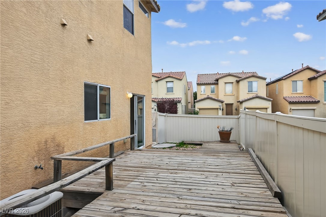 8038 Kings Ransom Street Las Vegas, NV 89139 - Photo 23 of 38 Wooden terrace with a residential view
