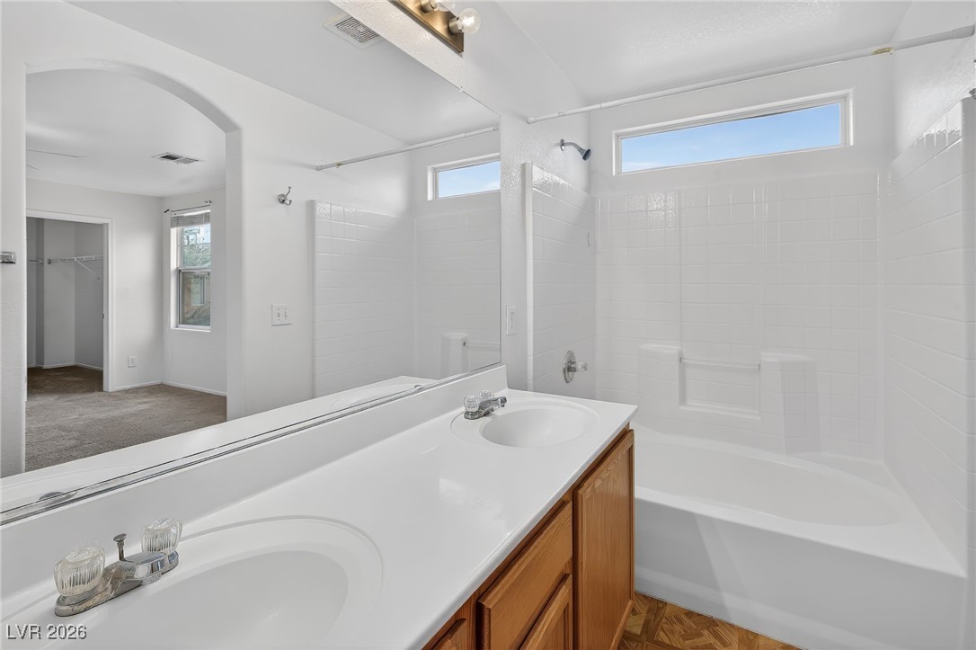 8038 Kings Ransom Street Las Vegas, NV 89139 - Photo 28 of 38 Full bath with shower combination, double vanity, and a walk in closet