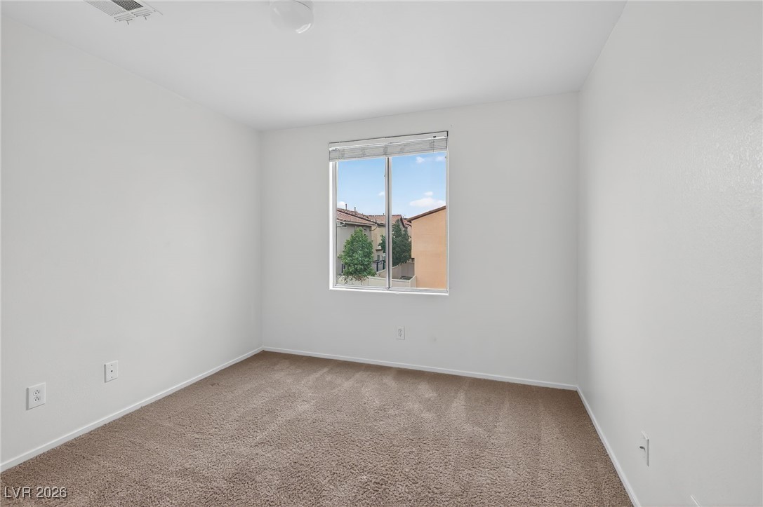 8038 Kings Ransom Street Las Vegas, NV 89139 - Photo 30 of 38 Empty room featuring carpet and baseboards