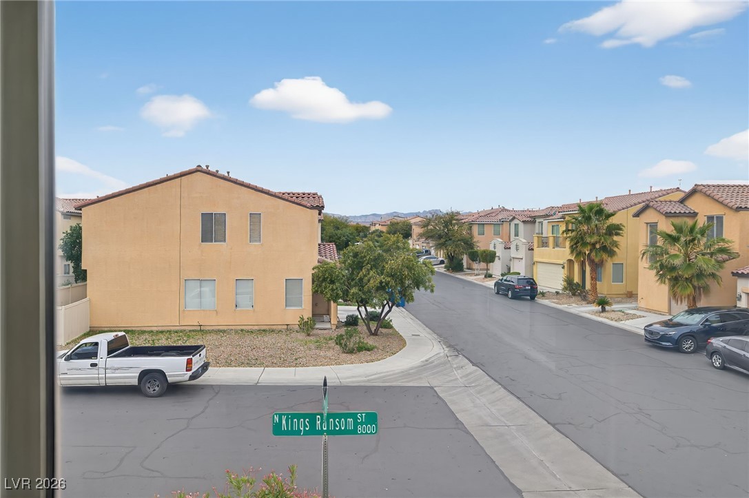 8038 Kings Ransom Street Las Vegas, NV 89139 - Photo 31 of 38 View of asphalt road featuring curbs and sidewalks