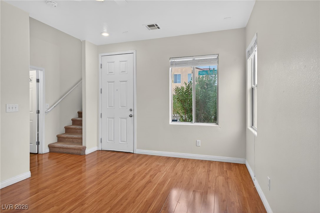8038 Kings Ransom Street Las Vegas, NV 89139 - Photo 7 of 38 Entryway with stairs and light wood-style floors