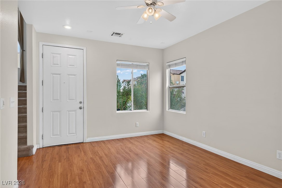 8038 Kings Ransom Street Las Vegas, NV 89139 - Photo 8 of 38 Unfurnished bedroom with wood finished floors and a ceiling fan